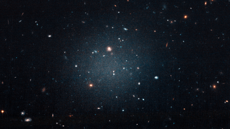 The slightly blurry spot of light in the middle of the image is the DF2 galaxy, scattered so that other galaxies are clearly visible behind it.