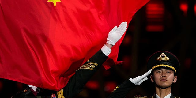 The Chinese flag hoisted during the women's free skating medal ceremony at the 2022 Winter Olympics