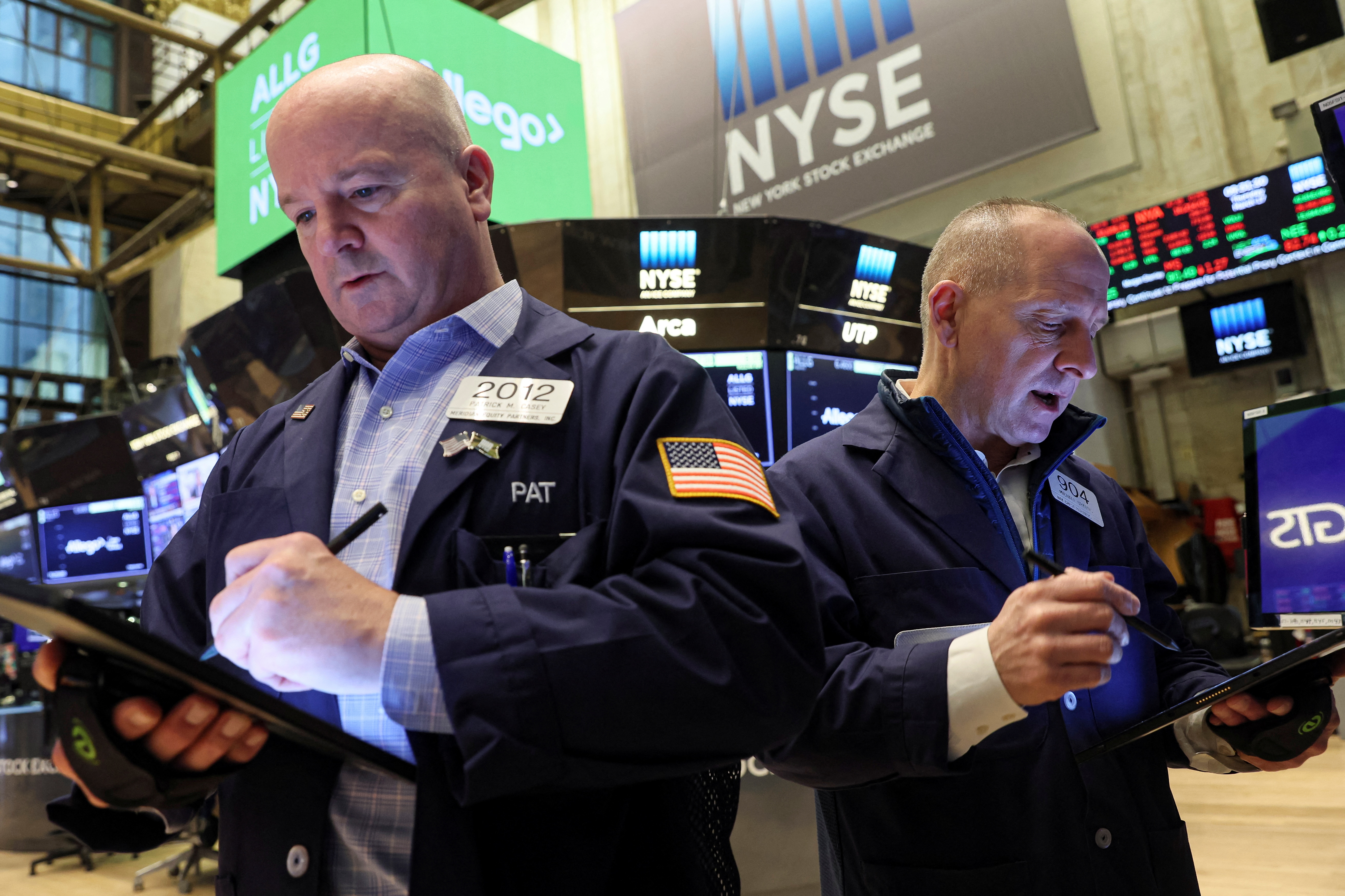 Traders work on the floor of the New York Stock Exchange in New York