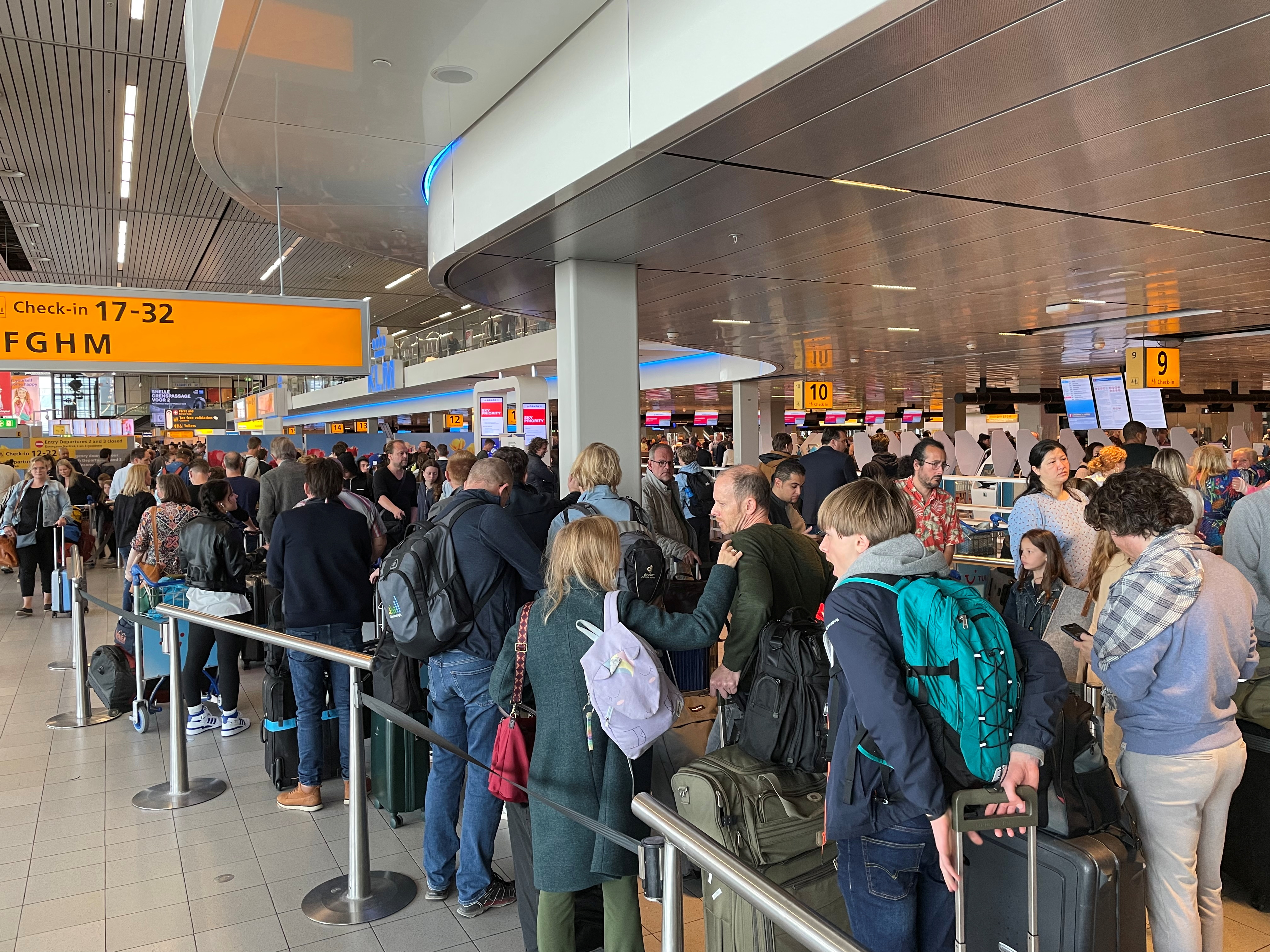 Long queues wait for passengers at Amsterdam Schiphol Airport due to a sudden strike