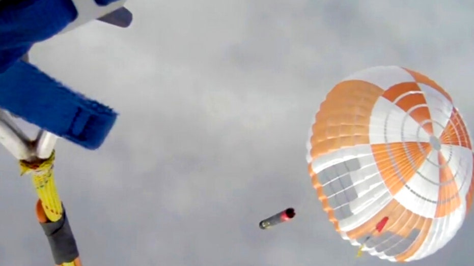 Helicopter trying to capture the first stage of the Electron missile