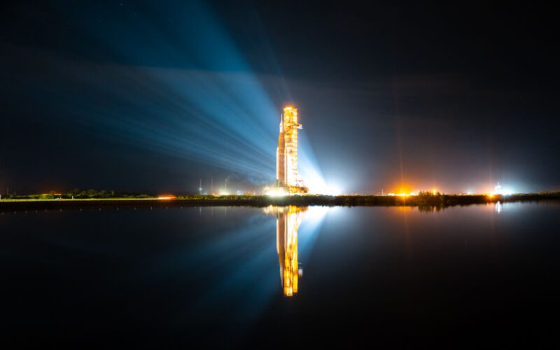 A NASA Space Launch System rocket, reflected in the spinning trough at Kennedy Space Center in Florida, lifts off for its fourth attempt at rehearsal on June 6, 2022.