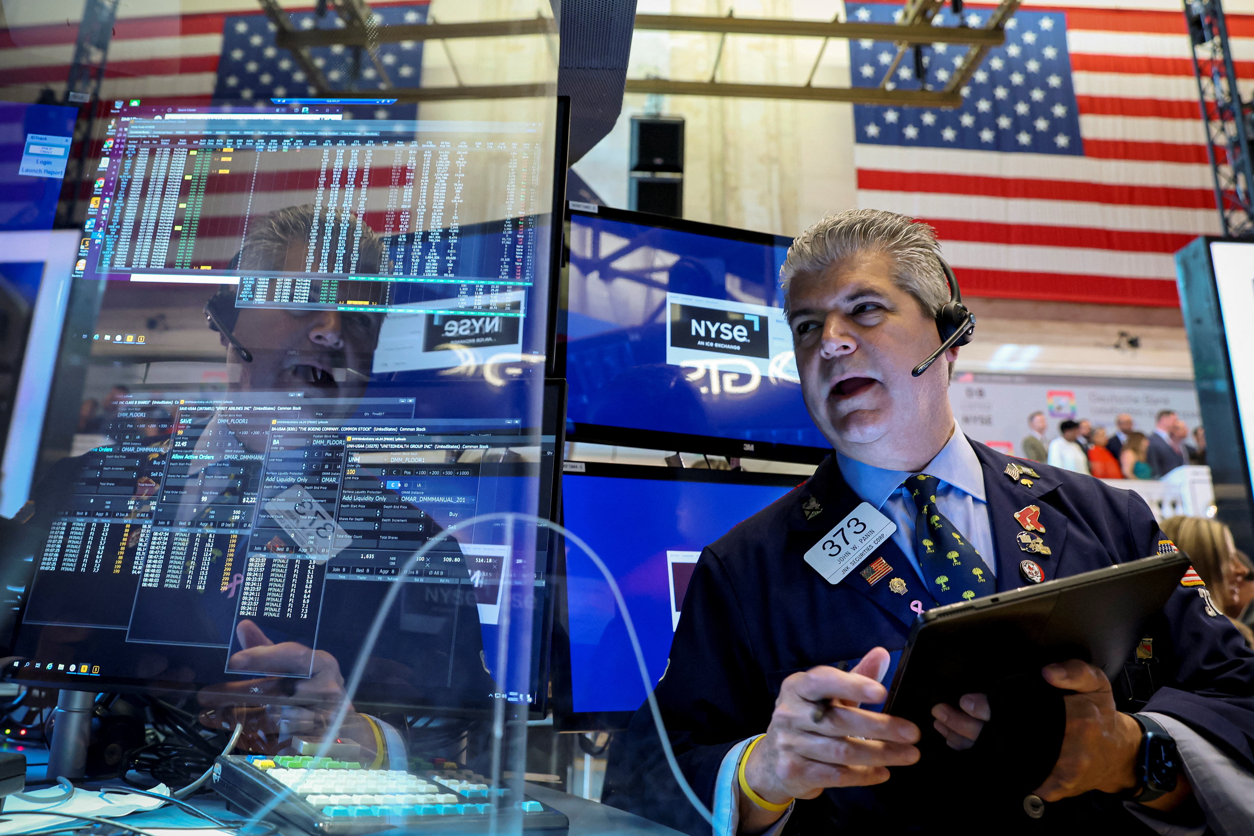 Traders work on the floor of the New York Stock Exchange in New York