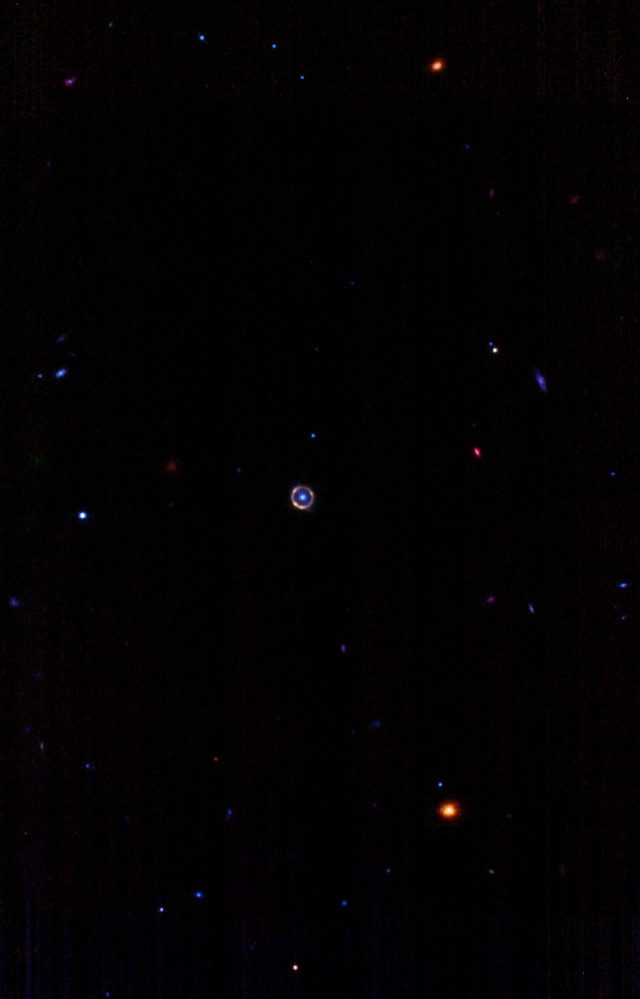 Far view of a yellow ring in space